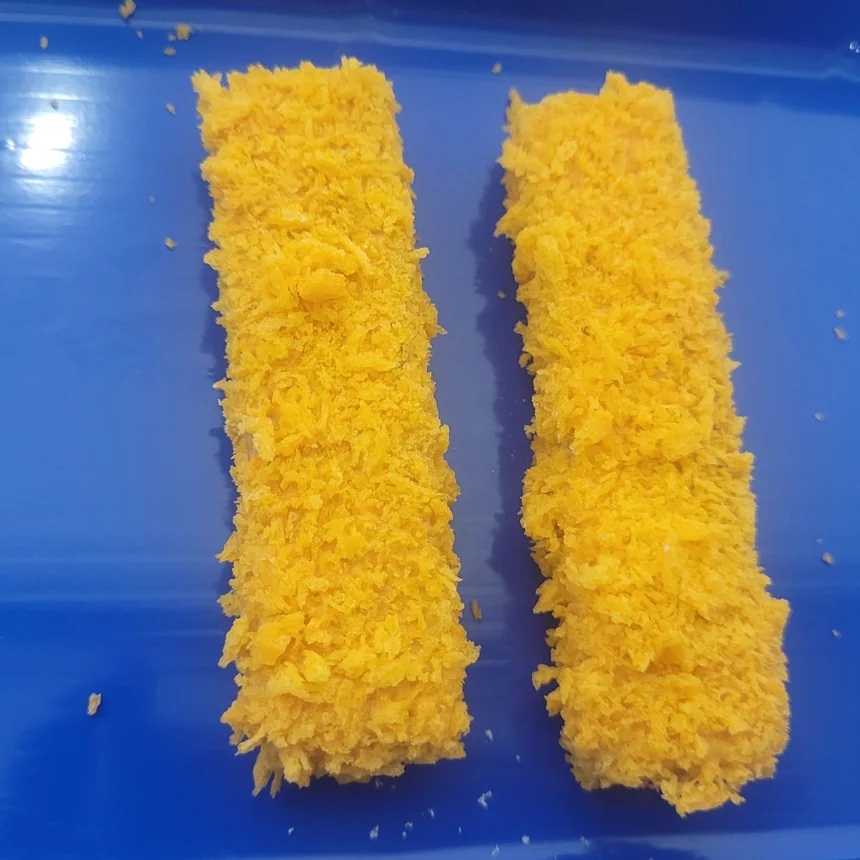 Fish fingers coated in orange crumb